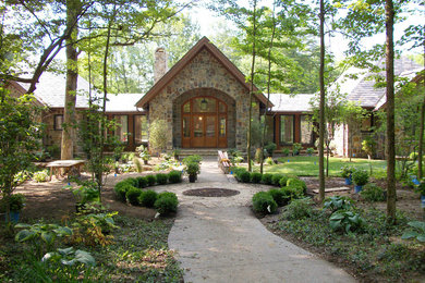 Photo of a large traditional front door in Indianapolis with white walls, a double front door, a medium wood front door and medium hardwood floors.