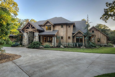 Inspiration for a rustic brown two-story wood gable roof remodel in Other