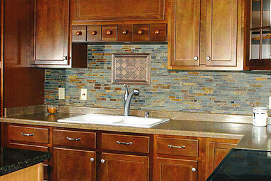 Mid-sized elegant l-shaped eat-in kitchen photo in Milwaukee with a double-bowl sink, flat-panel cabinets, medium tone wood cabinets and multicolored backsplash