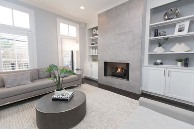 Inspiration for a mid-sized transitional formal open concept living room in Atlanta with grey walls, dark hardwood floors, a standard fireplace, a tile fireplace surround and brown floor.