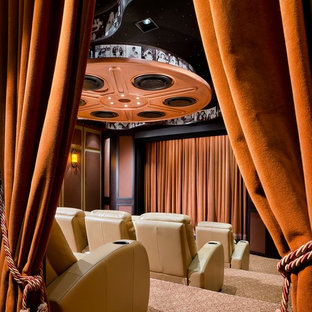 This is an example of a contemporary home cinema in Miami with multi-coloured floors.