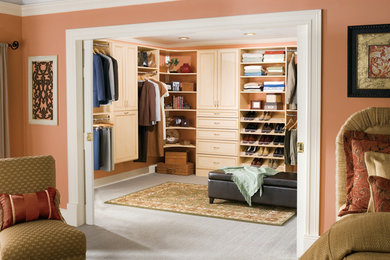 Example of a mid-sized classic gender-neutral walk-in closet design in Birmingham