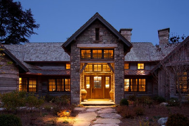 Large rustic mixed siding exterior home idea in Other