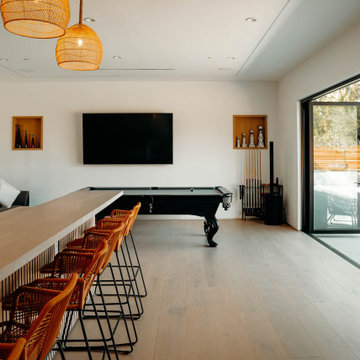 Game room with pool table and bar seating - Woodland Hills