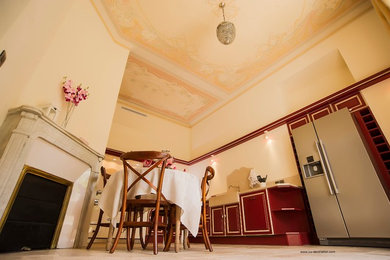 Example of a tuscan kitchen design in Nice