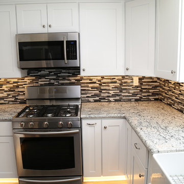 Kitchen Remodel with White Shaker Style Cabinets and Granite