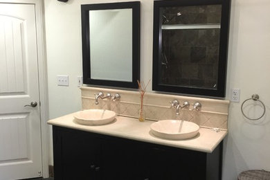 Alcove shower - mid-sized contemporary master slate floor and gray floor alcove shower idea in San Francisco with furniture-like cabinets, black cabinets, white walls, a vessel sink and granite countertops