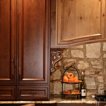 Mediterranean Luxury Kitchen Remodel | Stone Accents & Arched Detailing