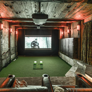 Home theater - large rustic enclosed home theater idea in Minneapolis with brown walls and a projector screen