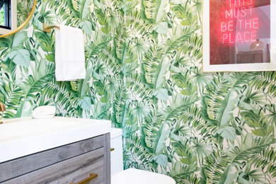 Inspiration for a large 1960s master green tile and ceramic tile gray floor, double-sink and wallpaper open shower remodel in New York with flat-panel cabinets, gray cabinets, green walls, a drop-in sink, marble countertops, white countertops and a freestanding vanity