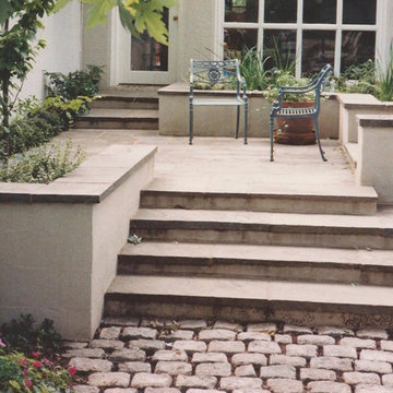 Natural Stone Paving with Stucco Walls and Bluestone Coping