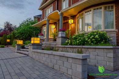 Photo of a mid-sized modern front yard landscaping in Toronto.