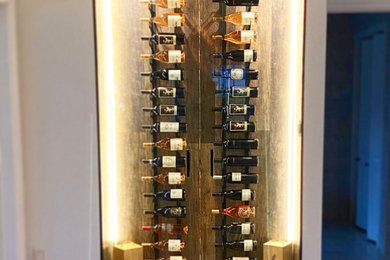 Photo of a contemporary wine cellar in Miami.