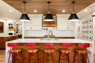 Eat-in kitchen - huge modern galley light wood floor, beige floor and wood ceiling eat-in kitchen idea in Minneapolis with a double-bowl sink, flat-panel cabinets, medium tone wood cabinets, quartz countertops, white backsplash, quartz backsplash, stainless steel appliances, two islands and yellow countertops