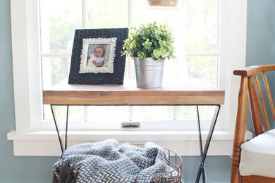 Example of a mid-sized farmhouse medium tone wood floor dining room design in Philadelphia with blue walls