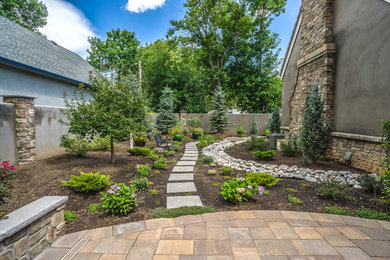 Inspiration for a large traditional side yard partial sun formal garden for summer in Denver with concrete pavers and with privacy feature.