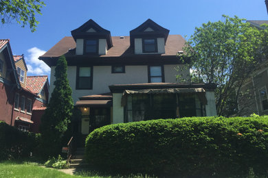 Example of a mid-sized arts and crafts two-story exterior home design in Minneapolis with a mixed material roof