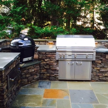 Outdoor Kitchen with built-in Big Green Egg & Grill on a flagstone Patio VA