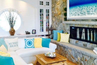 Mid-sized beach style open concept light wood floor family room photo in New York with white walls, a ribbon fireplace, a stone fireplace and a wall-mounted tv