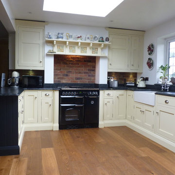 1909 in-frame charcoal and ivory kitchen, leathered steel grey granite worktops