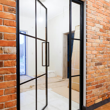Industrial-style steel doors with an opening panel