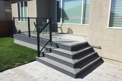 Inspiration for a modern backyard landscaping in Other with decking.
