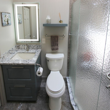 Small Masterbath with Green Cabinetry, Custom Tiled Shower and Storage