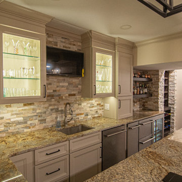Basement Showing Warm Colors, Straight Lined Cabinets and Stacked Stone
