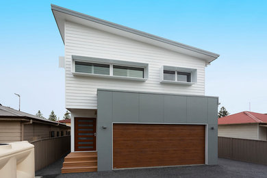 This is an example of a beach style home design in Other.