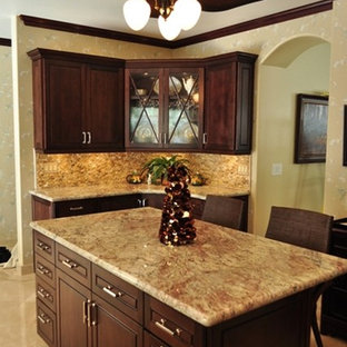 Large craftsman kitchen pantry inspiration - Kitchen pantry - large craftsman u-shaped terra-cotta floor kitchen pantry idea in Hawaii with an undermount sink, raised-panel cabinets, medium tone wood cabinets, marble countertops, multicolored backsplash, stone tile backsplash, stainless steel appliances, an island and multicolored countertops