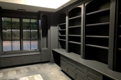 Inspiration for a mid-sized transitional built-in desk home office library remodel in Orange County with gray walls