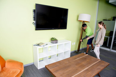 Example of a minimalist family room design in San Diego