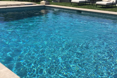 Inspiration for a large timeless pool remodel in Other