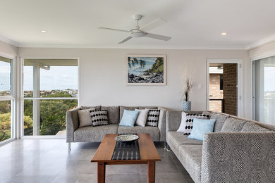 This is an example of a mid-sized modern open concept living room in Sunshine Coast with white walls.