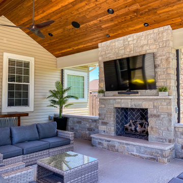 Pool-Side Outdoor Room with a Fireplace and Sitting Walls