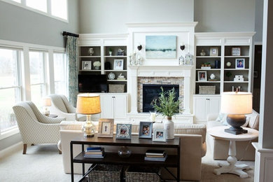 Inspiration for a large transitional open concept living room in Other with grey walls, carpet, a standard fireplace, a stone fireplace surround and beige floor.