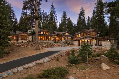 Inspiration for a large rustic brown one-story wood gable roof remodel in San Francisco