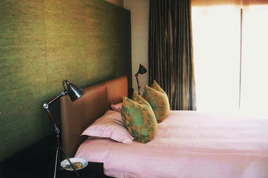 Example of a minimalist bedroom design in Other