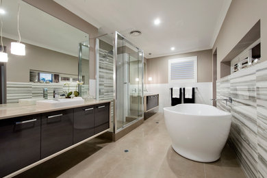 Design ideas for a contemporary master bathroom in Perth with a drop-in sink, raised-panel cabinets, brown cabinets, granite benchtops, a freestanding tub, an alcove shower, beige tile, ceramic tile, beige walls and ceramic floors.