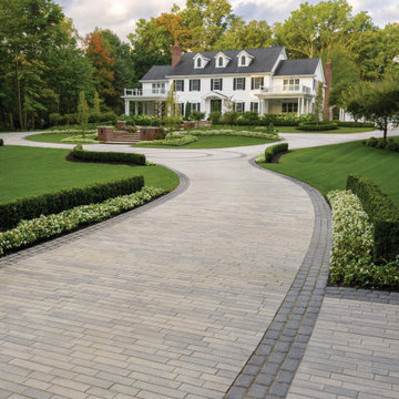 Traditional Curved Driveway with a Sophisticated Inlay Design