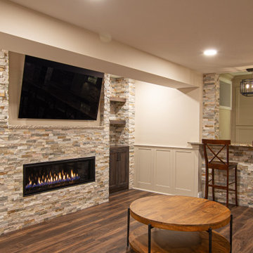 Basement Showing Warm Colors, Straight Lined Cabinets and Stacked Stone