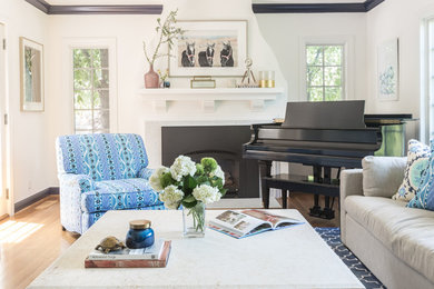 Living room - mid-sized transitional enclosed light wood floor and beige floor living room idea in San Francisco with a music area, white walls, a standard fireplace, a tile fireplace and a media wall