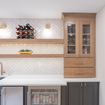 Warm & Inviting Basement Retreat with Custom Bar + Entertainment Center