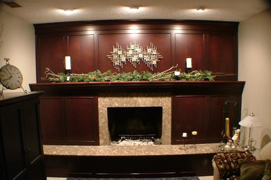 Mid-sized transitional carpeted family room photo in Grand Rapids with beige walls, a standard fireplace and a stone fireplace