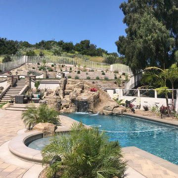 Rock Waterfall with Pool Slide and Grotto
