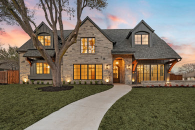 Elegant gray two-story concrete fiberboard and board and batten exterior home photo in Dallas with a shingle roof and a gray roof