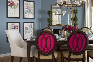 Inspiration for a mid-sized transitional medium tone wood floor enclosed dining room remodel in San Francisco with blue walls and no fireplace