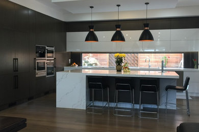 Inspiration for a large modern kitchen in Melbourne with with island.