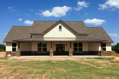Large mountain style beige two-story mixed siding gable roof photo in Oklahoma City
