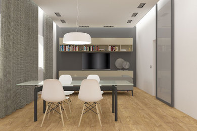 Foto di una grande sala da pranzo design con pareti bianche, parquet chiaro e soffitto ribassato